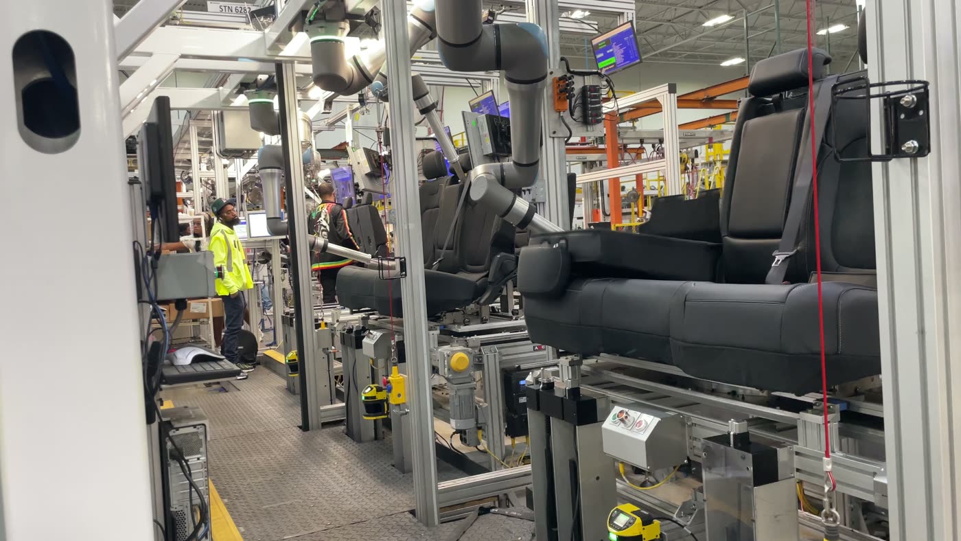 Robotic automation cell on an automotive seating production line